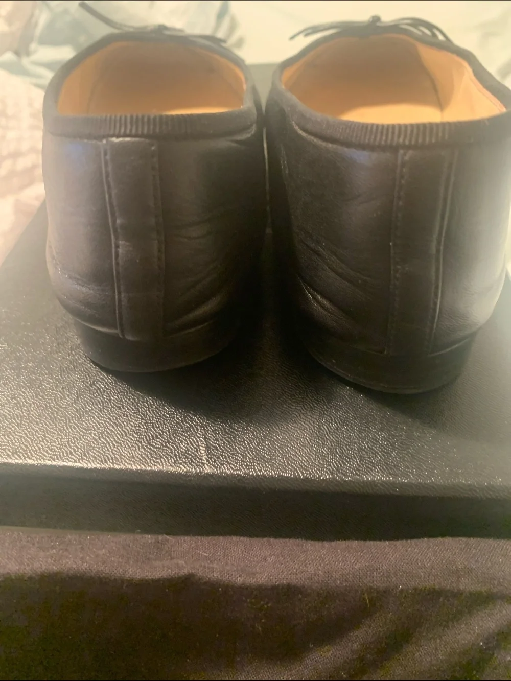 CHANEL Black Leather Cap-Toe CC Ballet Flats
